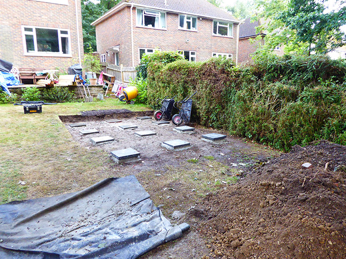 Stage 5 shows the screw piles in place