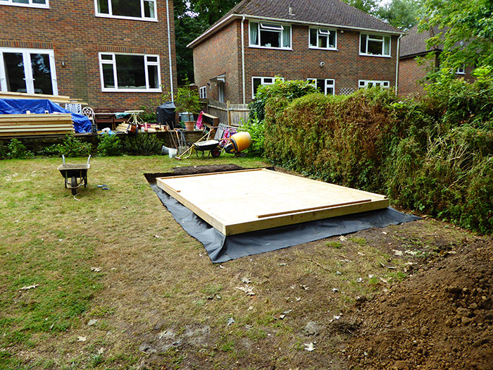Stage 8 shows the completed garden office flooring